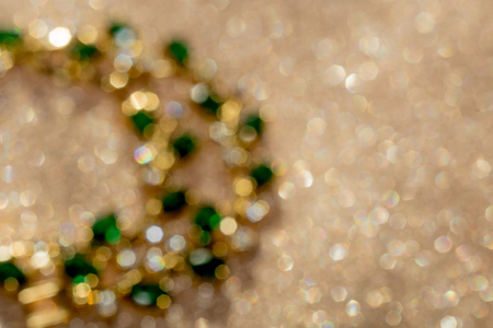 Elegant female jewelry golden bracelet with precious green gem, emerald.の写真素材