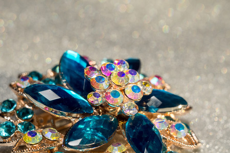 Decorative fashion flower shaped brooch with blue stones.の写真素材