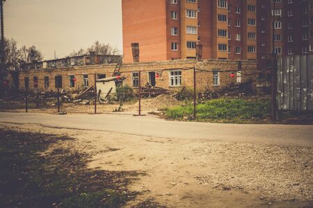 Round red warning lights on the metal mesh fence, construction site, vintage background.の写真素材