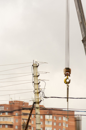 Close up background of yellow lifting crane hook, construction site.の写真素材