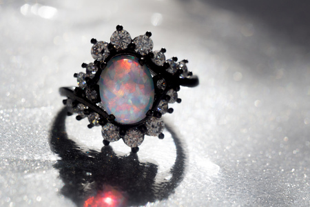 Fashion ring decorated with white fire opal stones.の写真素材