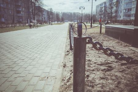 Close up of black chains barrier stand in the city park.の写真素材