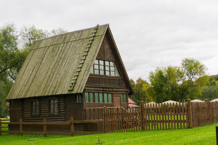 Traditional rural architecture, vintage wooden house and fence.の写真素材
