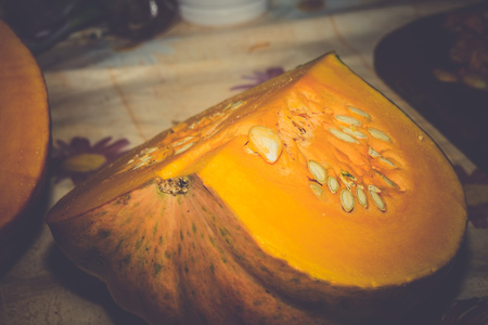 Just harvested big orange pumpkin, natural vegetables, retro background.の写真素材