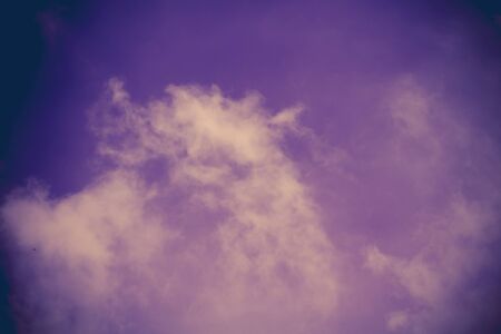 Dark sky with heavy stormy clouds, filtered natural background.の写真素材