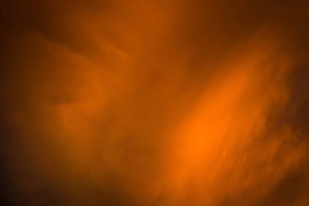 Summer sunset sky with clouds of red color.の写真素材