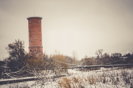 Vintage style red brick water tower of an old factory, filtered.の写真素材