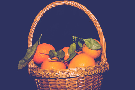 Tasty fresh orange mandarins on black background, filtered.の写真素材