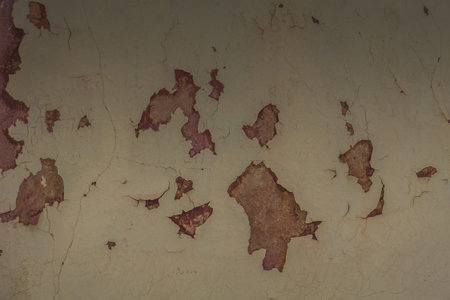 Grunge dirty wall close up, red cracked plaster background.