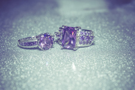 Fashion silver ring with purple zirconia, amethyst imitation, filtered.