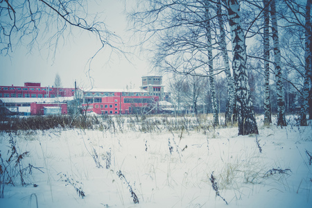 Vintage style red brick old factory, filtered winter time landscape.のeditorial素材