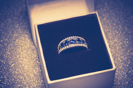 Fashion silver ring with blue purple tanzanite gem, filtered.の写真素材