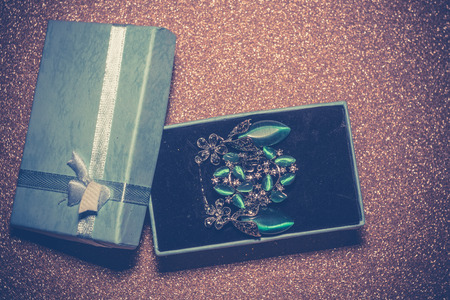 Silver ring decorated with zircons and green tiger or cat eye stone imitation.の写真素材