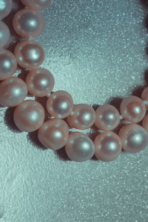 Beaded bracelet made of fresh water pearls, filtered background.