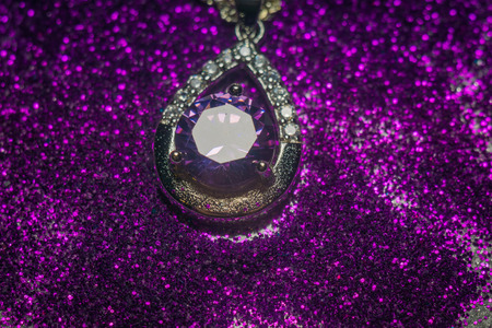 Fashion silver pendant with purple zirconia, amethyst imitation.の写真素材