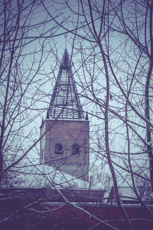 Vintage style red brick building, old factory, filtered winter time landscape.の写真素材