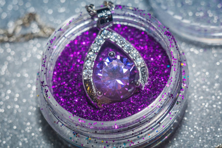 Fashion silver pendant with purple zirconia, amethyst imitation.の写真素材