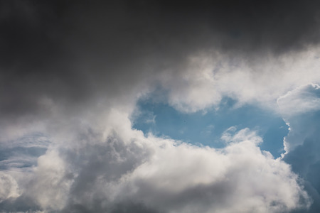 Heavy grey clouds in the sky before the rain.の写真素材