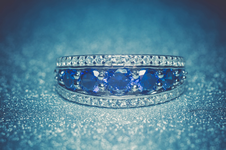 Fashion silver ring with blue purple tanzanite gem, filtered.の写真素材