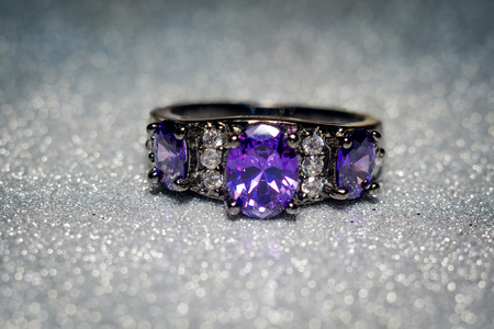 Fashion silver ring with purple zirconia, amethyst imitation.の写真素材