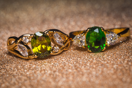 Precious golden ring decorated with green stone, zirconia.の写真素材