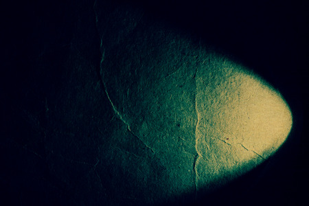 Combination of grunge paper and light streaks as abstract background.の写真素材