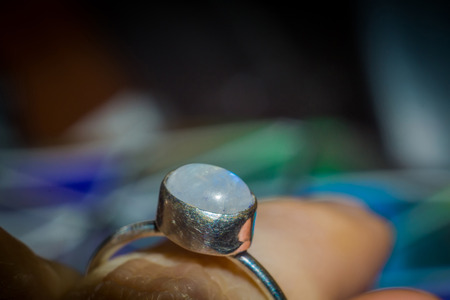 Stainless steel ring with natural white moonstone.の写真素材