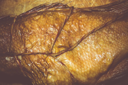 Appetizing smoked fish, ocean perch on a table.の写真素材