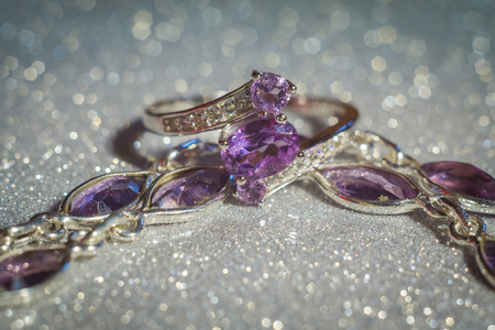 Fashion silver ring decorated with natural amethyst gemstone.の写真素材