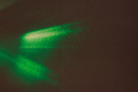 Combination of grunge paper and light streaks as abstract background.の写真素材