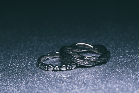 Fashion silver ring over glittering background, macro.の写真素材