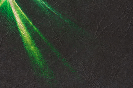 Combination of grunge paper and light streaks as abstract background.の写真素材