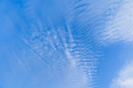 Peaceful blue sky with white clouds landscape.の写真素材
