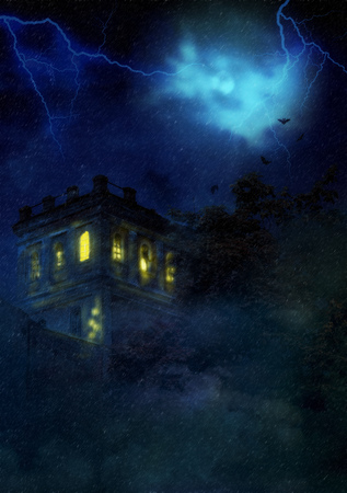 Abandoned old spooky castle during storm in the night.の写真素材