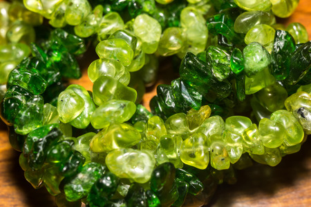 Dark green chrome diopside and olive green peridot, natural stone gravel close up.の写真素材