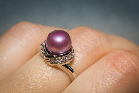 Luxury silver ring with natural freshwater pearl of purple color, macro.の写真素材