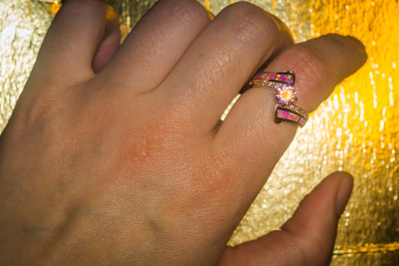 Fashion rose gold ring with pink zircon and synthetic opal stone.の写真素材