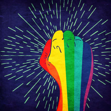 Raised clenched fist in rainbow colors, fight for lgbt rights concept, textured retro design background.の写真素材