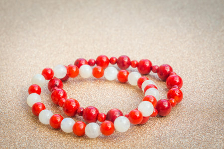 Boho bracelet made of white moonstone and red coral round beads.