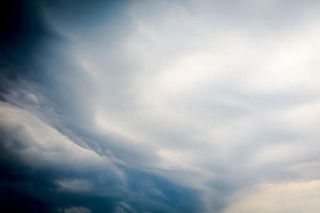 Stormy sky with dark heavy clouds background.の写真素材