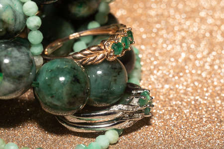 Natural emerald, beryl beaded bracelet, necklace and yellow gold ring.の写真素材