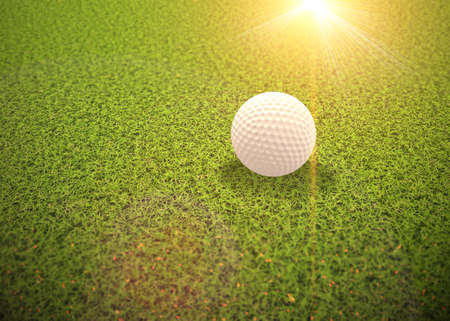 Digitally rendered golf ball on the green grass background.の写真素材