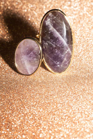 Bohemian golden ring with purple rough natural amethyst stone.の写真素材
