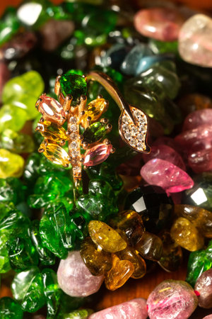 Boho tourmaline and chrome diopside beaded necklace and bracelet with rose gold ring, close up.