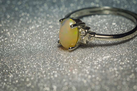 Fashion silver ring with natural white ethiopian opal stone.の写真素材