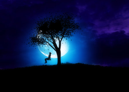 Silhouette of a girl on a swing under the big tree at night time.Elements for this image is furnished by NASAの写真素材