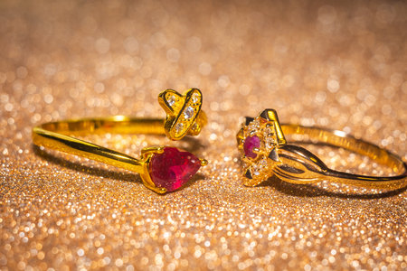 Fashion golden ring with ruby, close up background.の写真素材