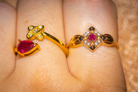 Fashion golden ring with ruby, close up background.の写真素材