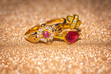 Fashion golden ring with ruby, close up background.の写真素材