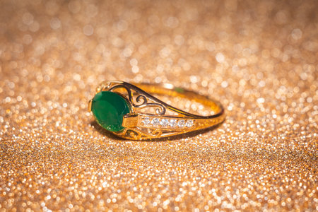 Fashion golden ring with green agate, close up background.の写真素材